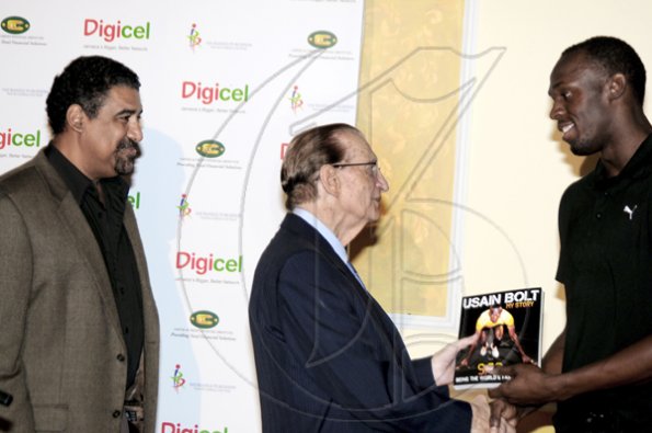 Winston Sill / Freelance Photographer
Launch and book signing of Usain Bolt book, "My Story 9.58-- Being The World,s Fastest Man", held at the Terra Nova All-Suite Hotel, Waterloo Road on Thursday night October 21, 2010. Here are Dr. Wykeham McNeill (left); Edward Seaga (centre); and Bolt (right).