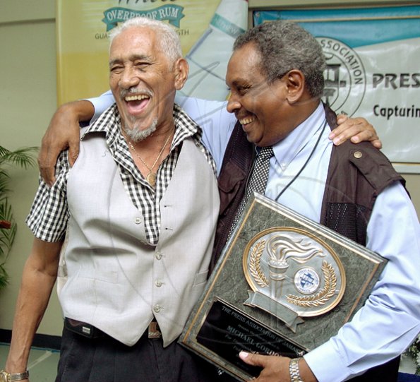 Peta-Gaye Clachar/Freelance Photographer
Former Gleaner Company's Photographer Mr. Junior Dowie (left) shares a light joke with his friend and honouree Mr. Michael Gordon from the Jamaica Observer at the Press Association of Jamaica Veterans' Luncheon at the Girl Guides Association on Wednesday, December 2, 2009.Mr. Winston Sill from the Gleaner Company, Mr. Ken Dawson Videographer formerly from TVJ,and Mr. Ruddy Matherson were also honoured.