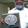 Peta-Gaye Clachar/Freelance Photographer
Veteran Mr. Winston Sill displays his award that he received at the Press Association of Jamaica Veterans' Luncheon at the Girl Guides Association on Wednesday, December 2, 2009. Mr. Michael Gordon Photographer from the Jamaica Observer, Mr. Ken Dawson Videographer formerly at TVJ and Mr. Ruddy Mattherson also a Videographer were also honoured.