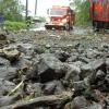 Norman Grindley
A fire truck rushes to help marooned residents in Mammee River, St Andrew but first has to get by a large piles of rock and silt.
.